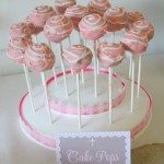 multiple lemon cake pops standing on a tray