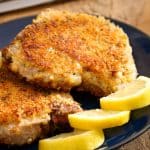 parmesan crusted pork chops served in a plate