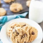 plate of peanut butter chocolate chip cookies and a glass of milk