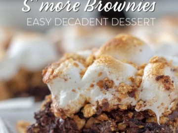 S'mores brownie on a plate with more brownies in the background.