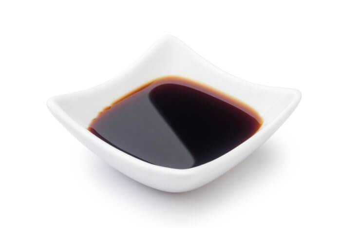 Homemade soy sauce in a white dish