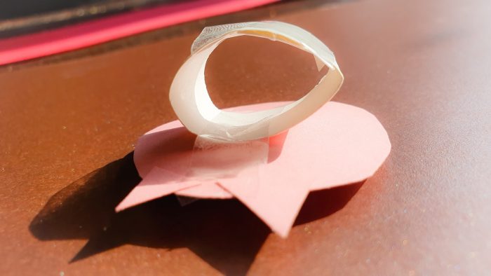 sticky tape taped at the back of the pig face to form a finger ring