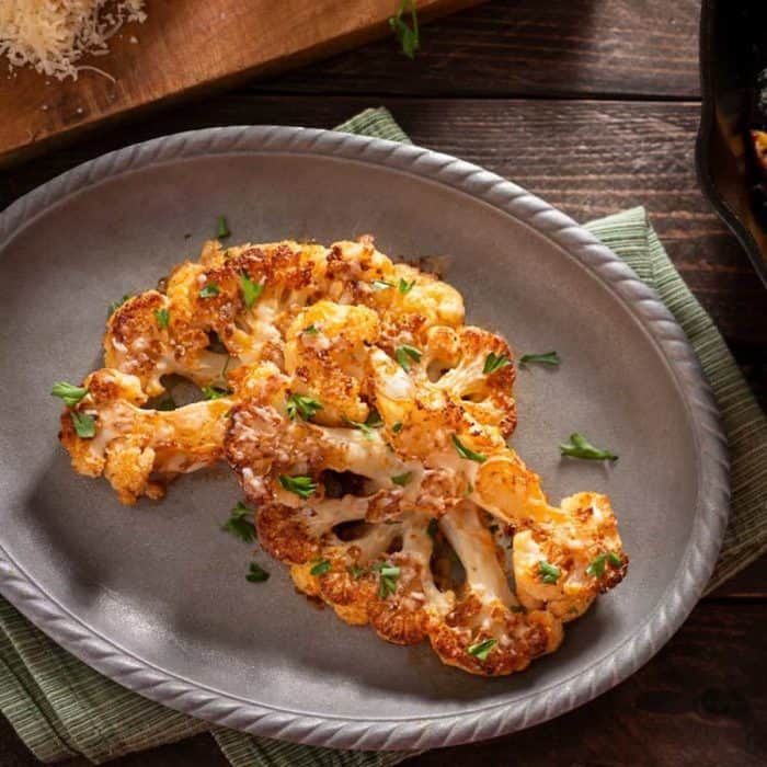 you can serve the cauliflower steaks with a drizzle of balsamic glaze or a sprinkle of chopped fresh herbs for added flavor.