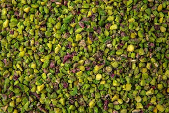 a close up image of crushed pistachio