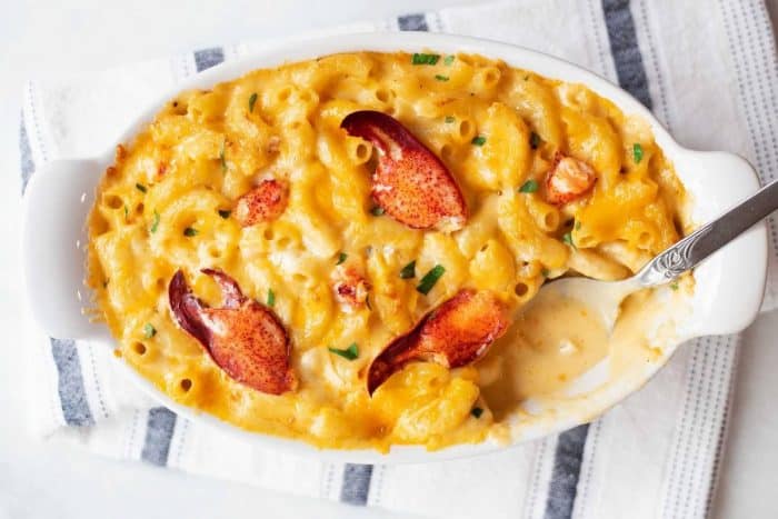 Elbow macaroni swims in a decadent sauce of cheeses, joining the briny sea flavor of lobster