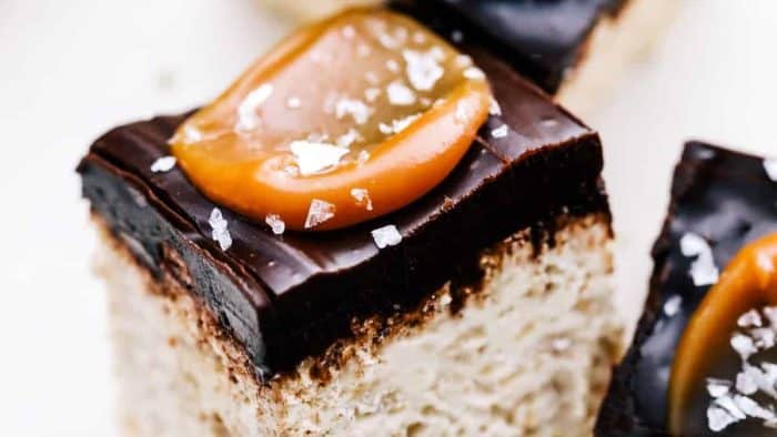 These salted caramel Rice Krispies Treats are a dessert dream come true. They’re made with marshmallow fluff swirled with salted caramel and topped with chocolate ganache, caramel, and sea salt flakes