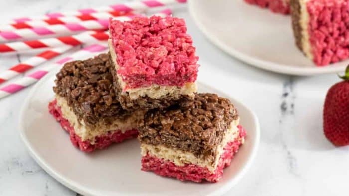 This delightful twist on a classic is a fun way of creating three layers of chocolate, vanilla, and strawberry into your Rice Krispies Treats to make a delicious and colorful dessert. 