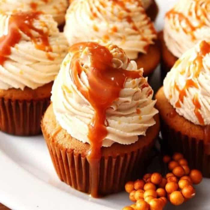 These cupcakes feature a brown sugar cake filled with caramel sauce and crowned with caramel buttercream frosting, creating an indulgent and delightful treat.