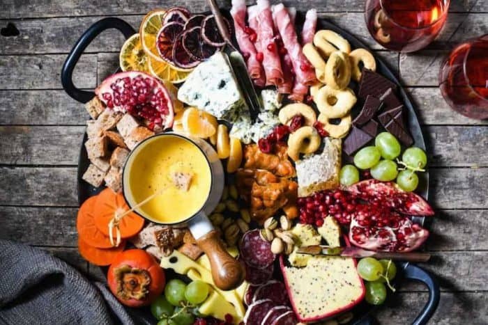 This cozy board pairs the timeless appeal of charcuterie classics with the warm, gooey delight of German beer cheese fondue.
