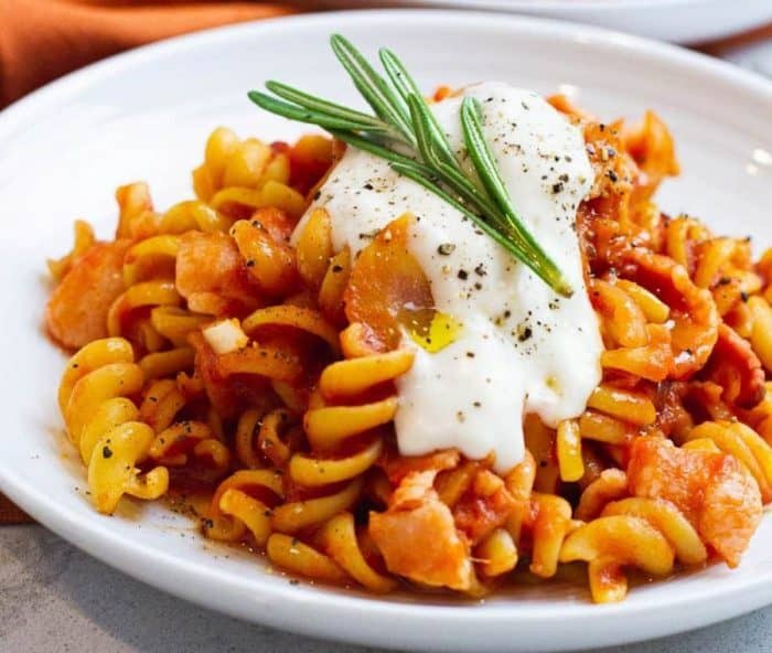 dairy-free, gluten-free pasta recipe with bacon tomato pasta, a dish that marries the smokiness of bacon with the richness of tomato sauce, complemented by a hint of aromatic rosemary