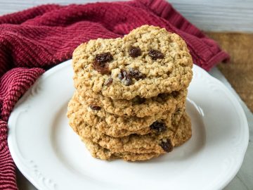 Golden-brown oatmeal raisin cookies delight with their crispy surface and chewy center. Sweet raisins punctuate each bite, bursting with a fruity flavor that perfectly complements the hearty oats.