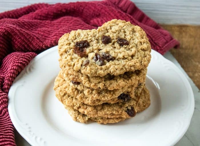 Golden-brown oatmeal raisin cookies delight with their crispy surface and chewy center. Sweet raisins punctuate each bite, bursting with a fruity flavor that perfectly complements the hearty oats.