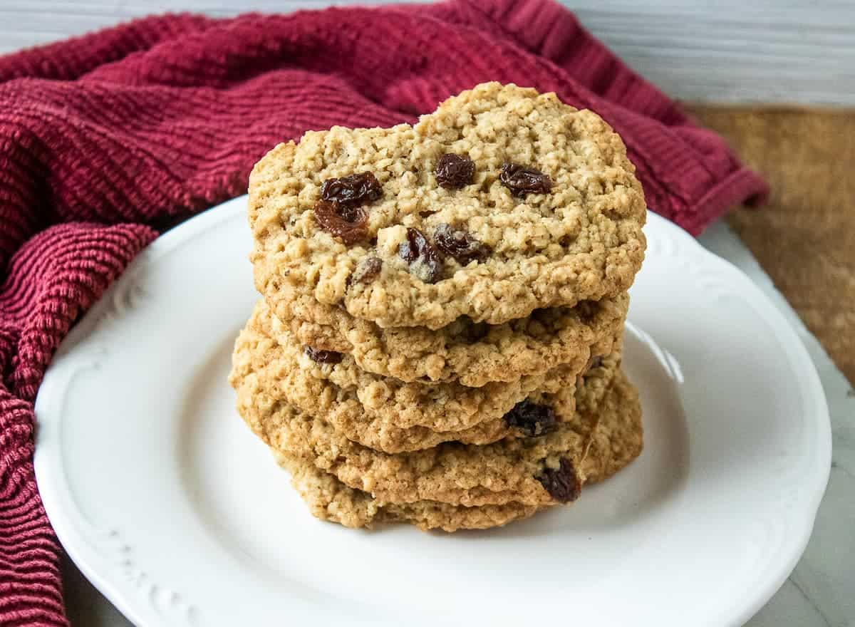 Golden-brown oatmeal raisin cookies delight with their crispy surface and chewy center. Sweet raisins punctuate each bite, bursting with a fruity flavor that perfectly complements the hearty oats.
