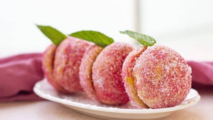 These cookies mimic the soft blush of ripe peach, with a lush filling that marries the flavors of a sweet summer fruit with the richness of cookies.