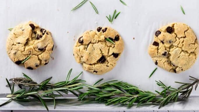 The herbaceous hint of rosemary provides an unexpected and delightful twist to the classic chocolate chip cookie, making it an elegant companion to your afternoon tea or coffee.
