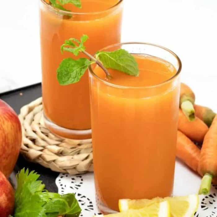freshly made glass of carrot celery juice