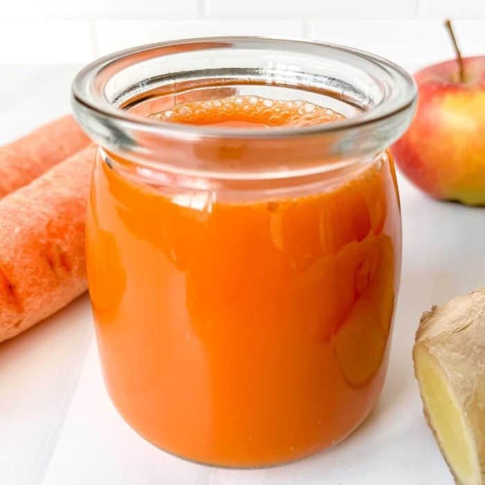this carrot ginger turmeric juice with a bright hue and bright flavors