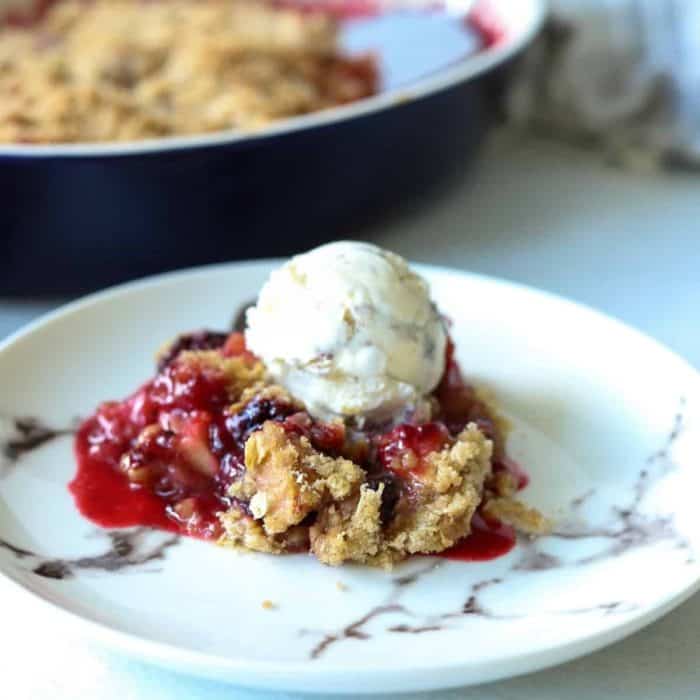 Dive into the rustic charm of an apple and blackberry crumble, where tart blackberries and sweet, tender apples unite under a golden crumble topping.