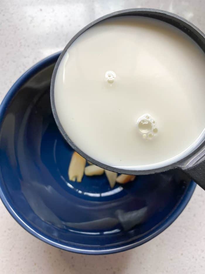 Mash the roasted garlic with a fork in a bowl with whole milk, or blend for a smoother texture.