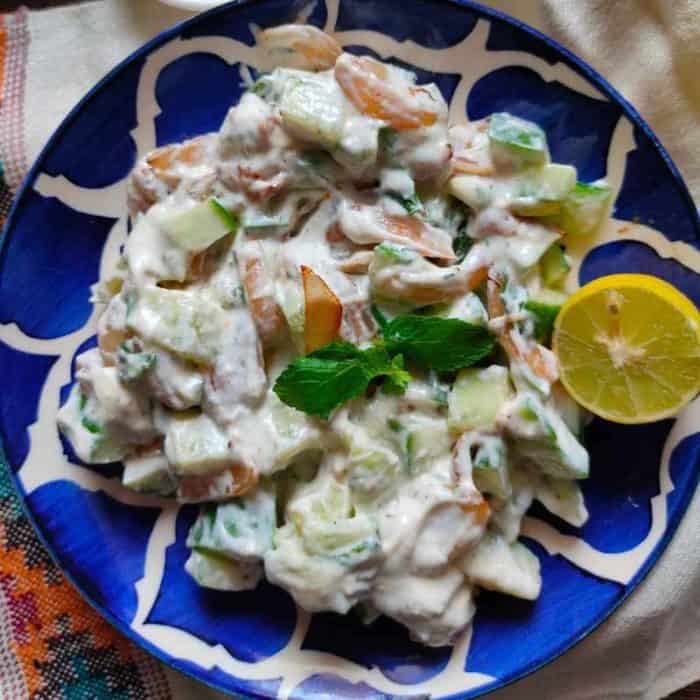 This refreshing salad brings together crisp cucumbers and sweet caramelized onions, enhancing them with a tangy Greek yogurt tzatziki dip