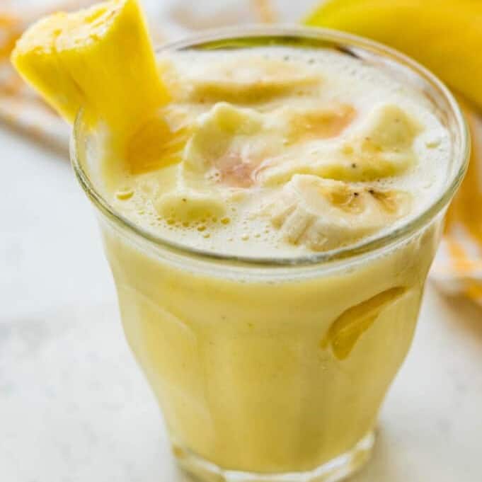 Blending tropical flavors into a pineapple banana smoothie creates a refreshing escape in a glass, with creamy Greek yogurt adding a smooth texture that complements the vibrant fruitiness.