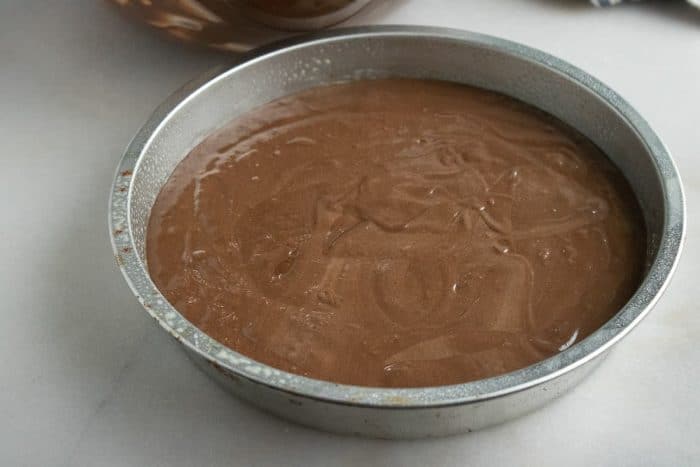 Evenly distribute the batter among your prepared pans and smooth out the tops.