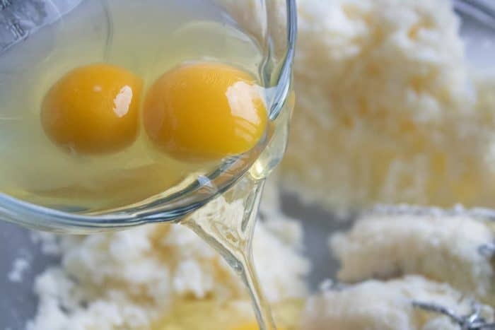 Crack in the eggs and pour in the vanilla extract, then continue to mix until they’re all perfectly blended together.