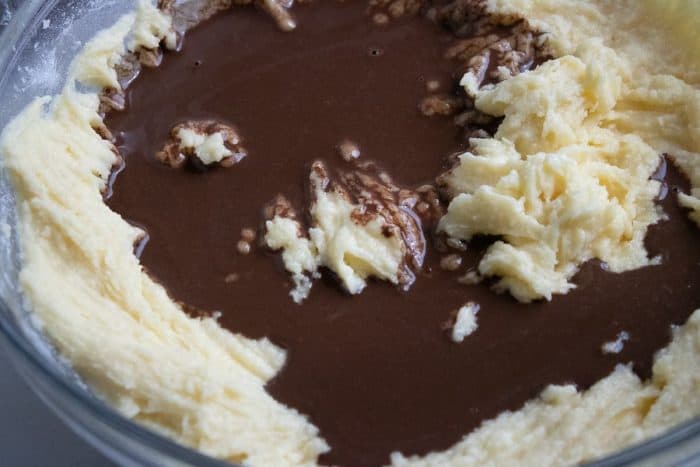 adding cocoa mixture to the creamy butter base