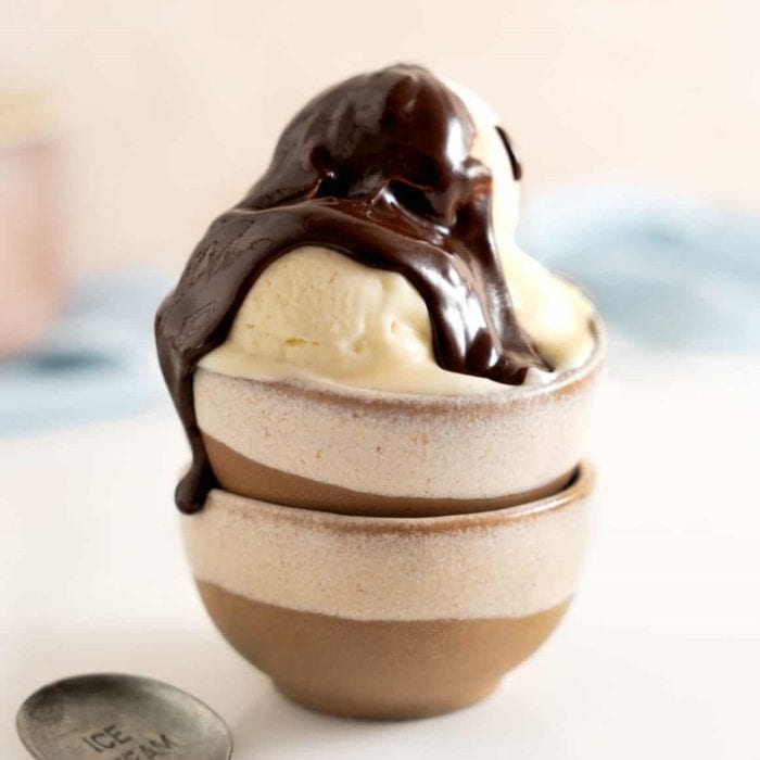 condensed milk ice cream on a small bowl topped with chocolate