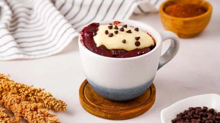 the eggless red velvet mug cake offers a delightful twist on the classic cake.