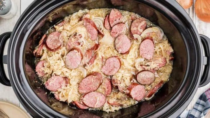The smoky essence of kielbasa sausage paired with the tangy sauerkraut mixture creates a must-try dish for your next family meal.