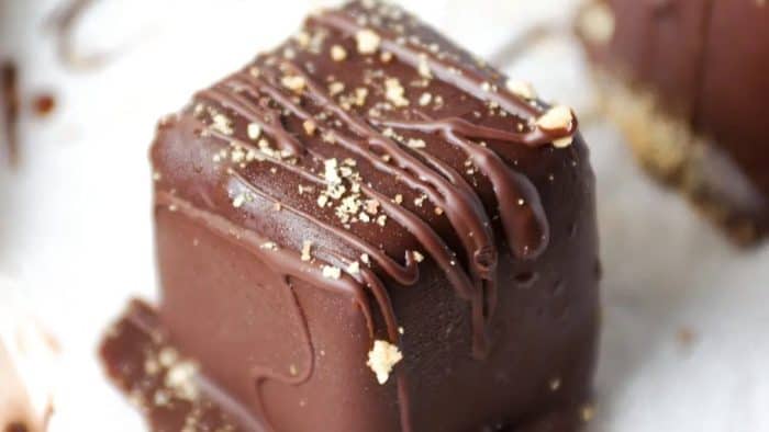 A shell of luscious chocolate cocoons each of these creamy and bite-sized mini cheesecakes