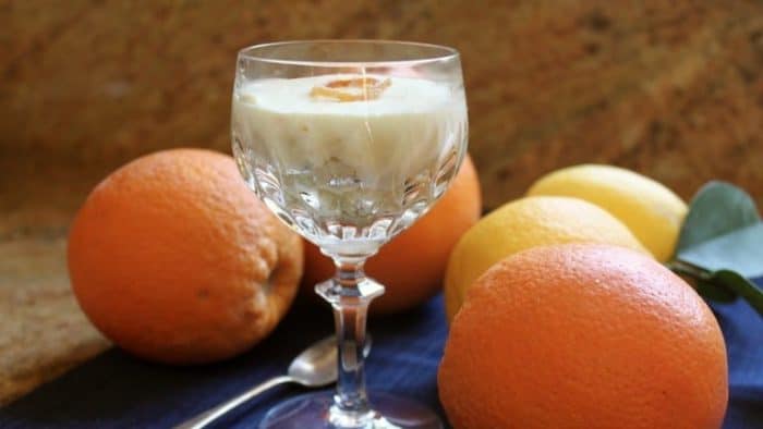 features a yellow cake base with a generous pouring of orange- and lemon-infused cream, offering a zesty and refreshing experience