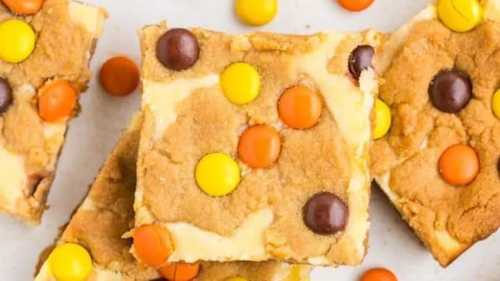 nutty goodness of the peanut butter cookie dough to the rich creaminess of the cheesecake topping, these bars offer a burst of different flavors and textures with every bite — especially with the addition of M&M
