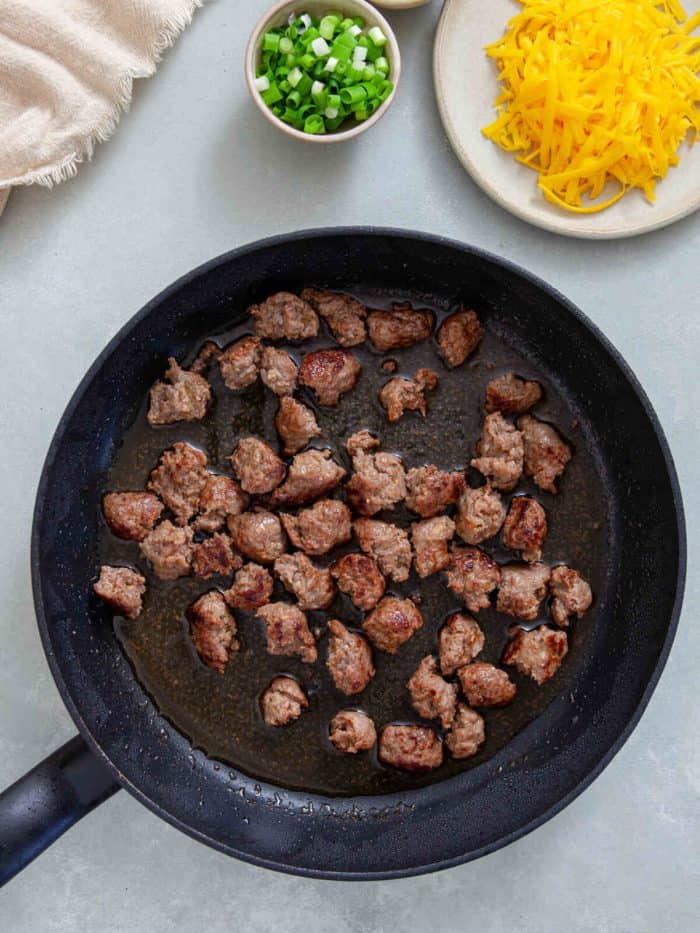 cooked sausage in a pan with