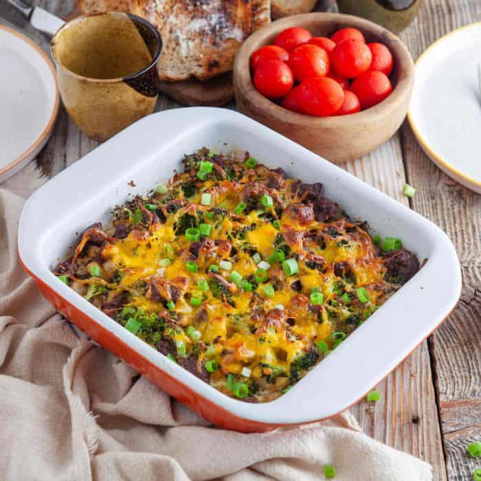 baked sausage and potato casserole on a wooden table