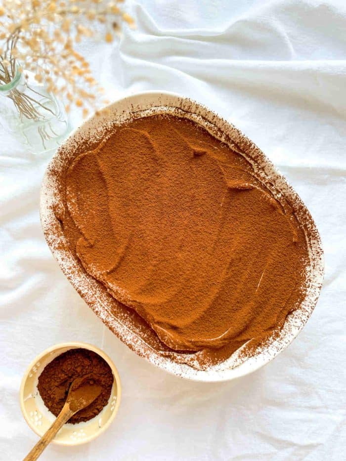 a photo of espresso tiramisu in a tub