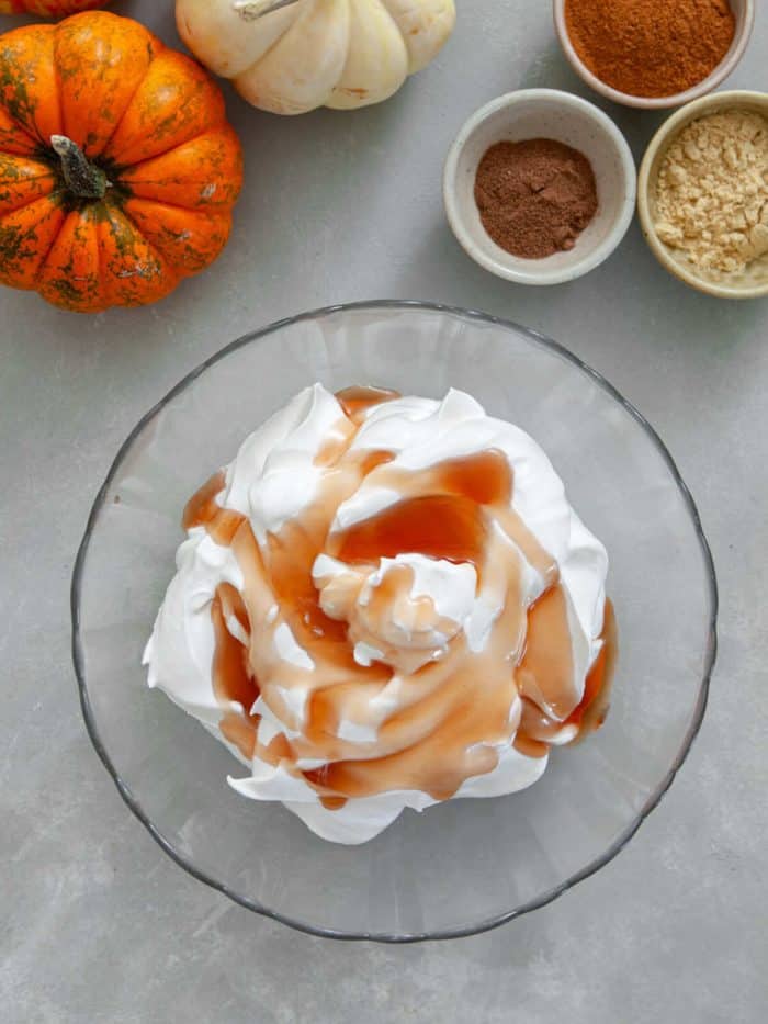 heavy cream and maple syrup on a glass mixing bowl