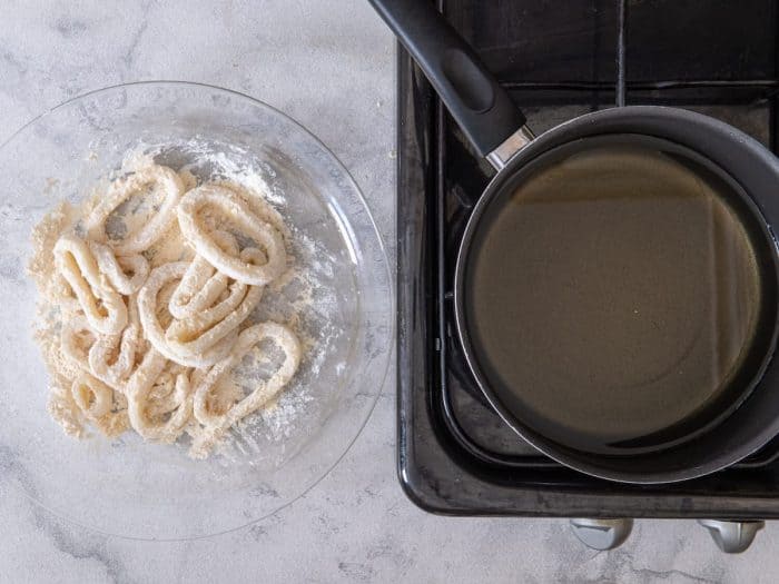 Add calamari rings one at a time to the flour mixture. Toss gently to coat and shake off excess.