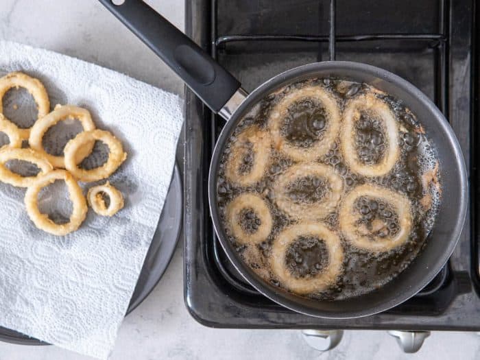 Heat vegetable oil in a pot to 340˚. Test oil by dipping a corner of one ring into it. If it sizzles, it’s hot enough. Add a few rings at a time.