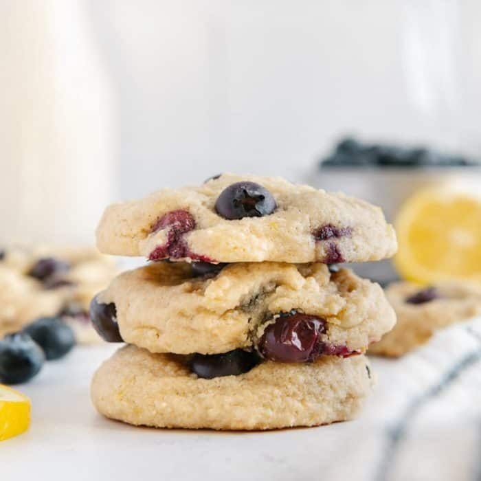 They boast a harmonious blend of tart and sweet flavors, combining the zing of a lemon-infused base with the burst of ripe blueberries in a soft-baked cookie that's as light as a cloud. 
