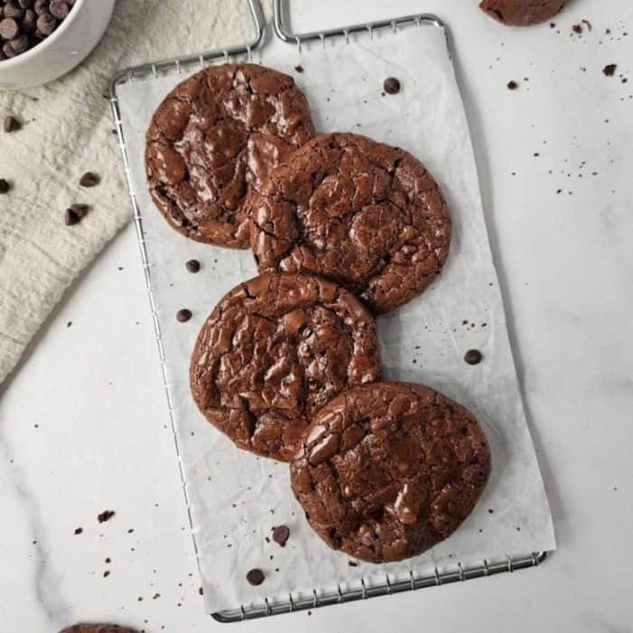 A decadent dream for chocolate fanatics, these flourless chocolate cookies have a rich, fudgy center encased in a crackly crust. 