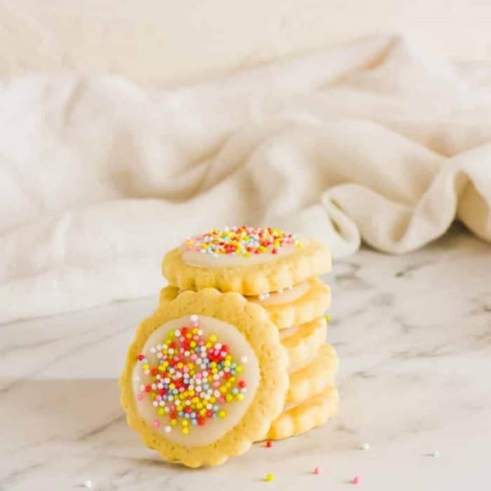 The cookie base is soft and buttery with just the right amount of sweetness and crunch. You can either dress it up with icing and sprinkles for a playful and whimsical touch or enjoy it in its pure, blissfully sugary form. 