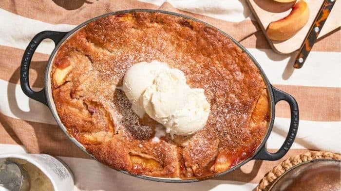 this vegan peach cobbler layers juicy, sweet peaches under a golden cobbler topping