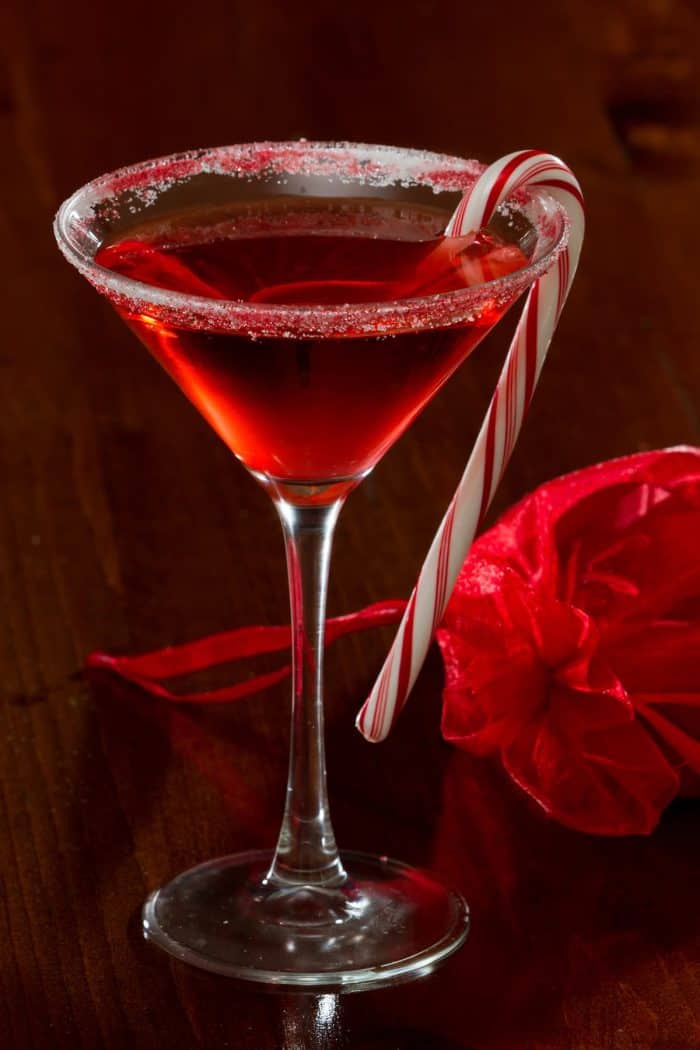 a glass of birthday martini isolated on a dark background