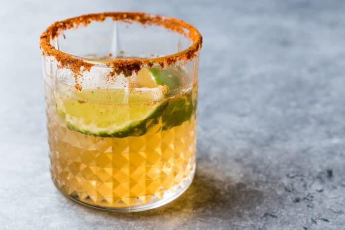 Spicy Honey Mezcal Margarita Cocktail with lime and Ice