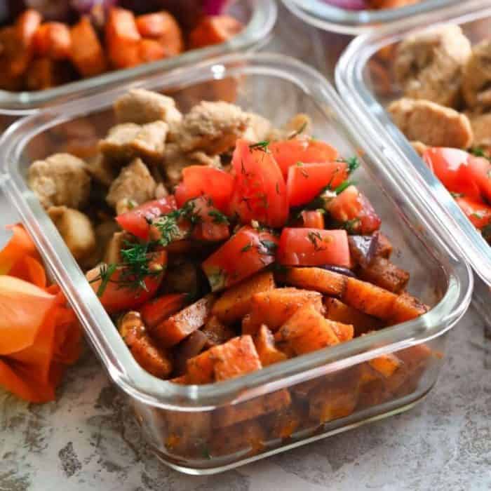 a small food tray with with chicken and sweet potato