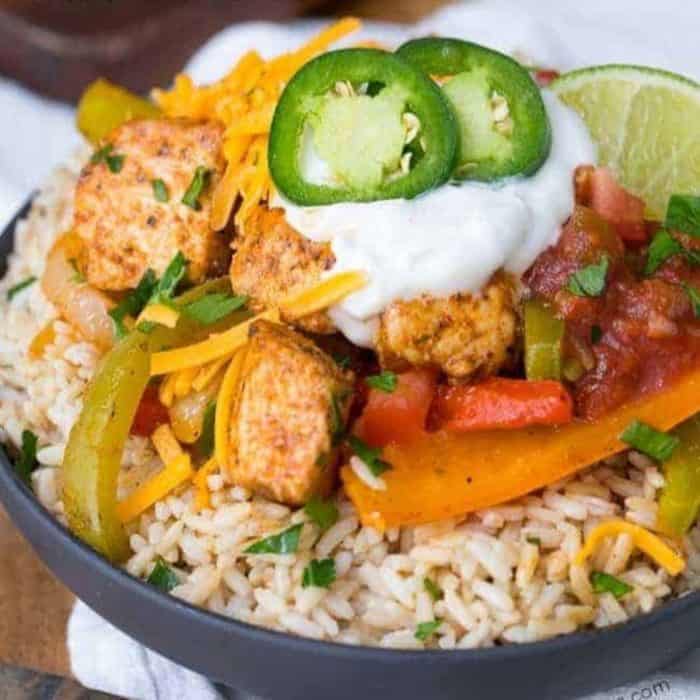 a close up photo of fully loaded fajita bowl