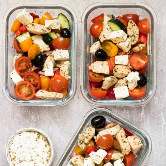 three pieces of greek chicken meal prep bowls