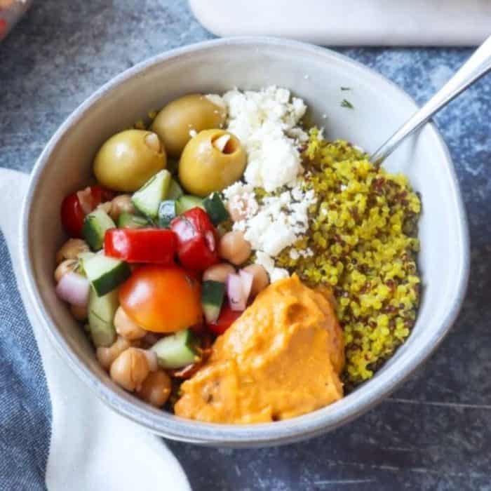 a white bowl full of best mediterranean power bowls 